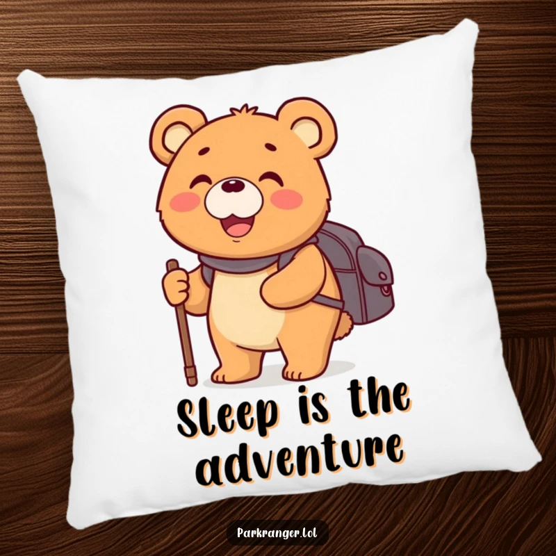 Funny pillow depicting a happy, round bear character with a backpack and walking stick, a soft and cozy decor item.