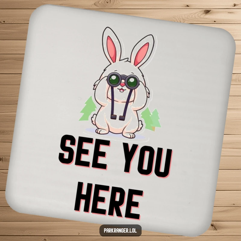 Funny coaster with a cheerful, fluffy rabbit character using binoculars to gaze at distant trees, a humorous and functional accessory.
