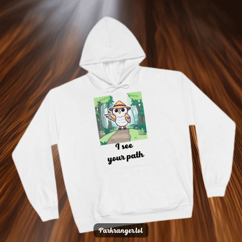 Funny hoodie featuring a cute stylized owl in a ranger hat pointing towards a forest path, perfect for outdoor enthusiasts.