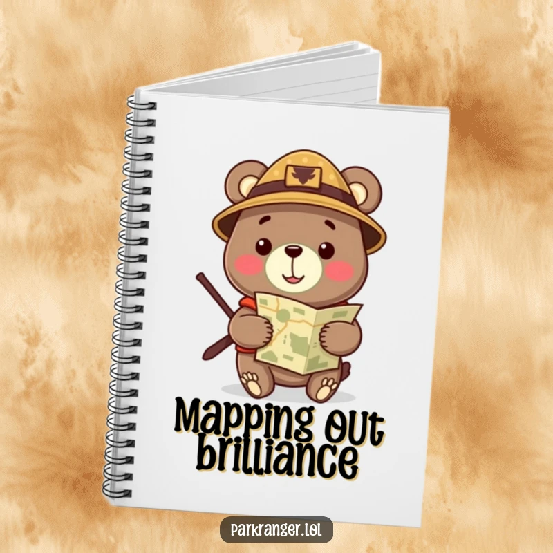 Funny Notebook featuring a cheerful bear in a ranger hat, holding a map, ideal for planning adventures and jotting notes.